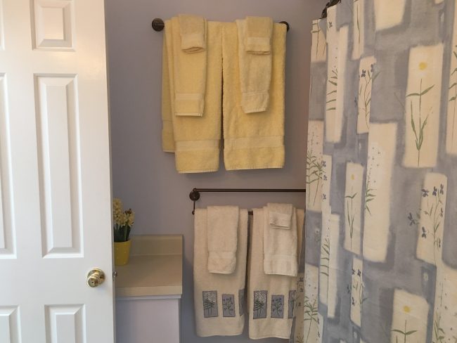 Full shower and tub in the Master Bath with color coordinated towels